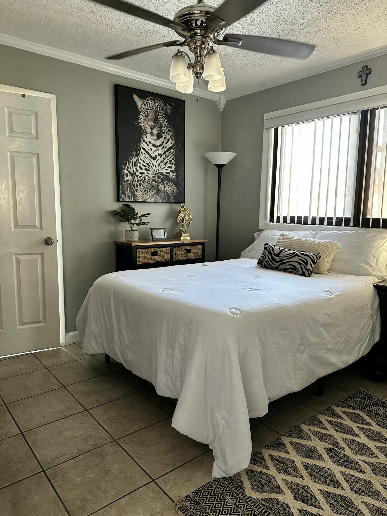 2922 Flagler Avenue Key West, FL 33040 - Photo 30 of 53 a bedroom with a bed and a chandelier