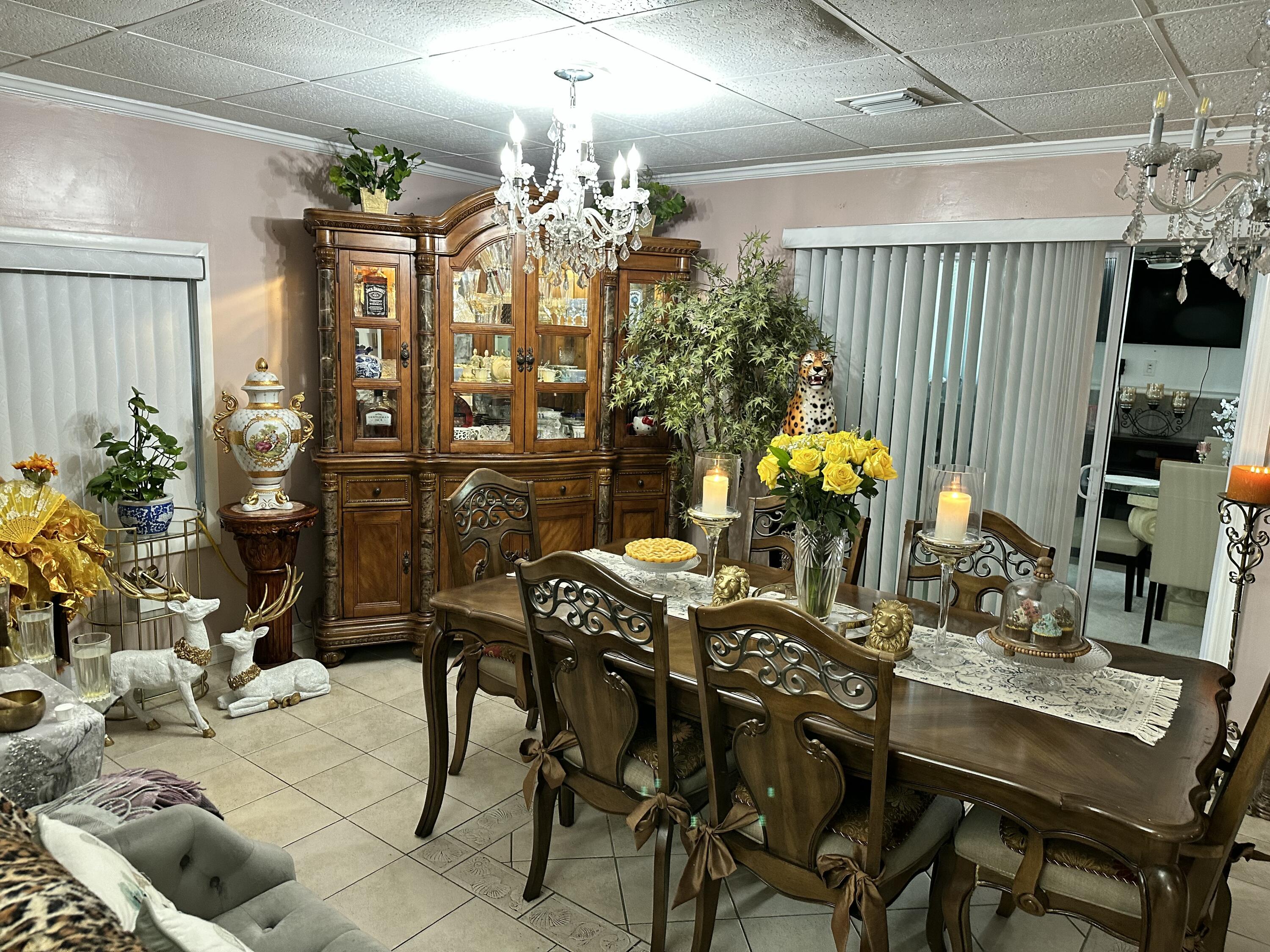 2922 Flagler Avenue Key West, FL 33040 - Photo 36 of 53 a view of a dining room with furniture and chandelier