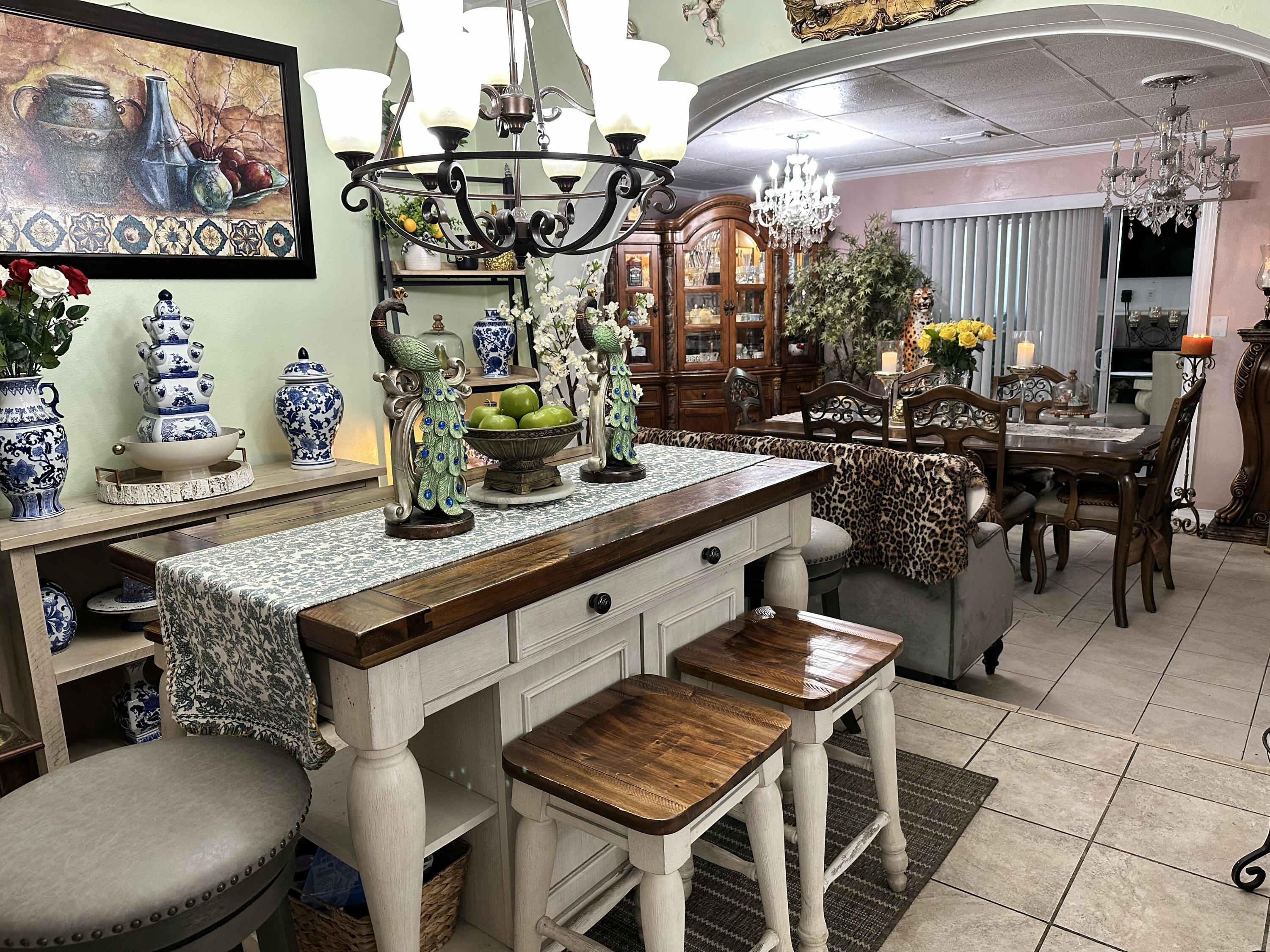 2922 Flagler Avenue Key West, FL 33040 - Photo 5 of 53 a kitchen with a table chairs and a potted plant