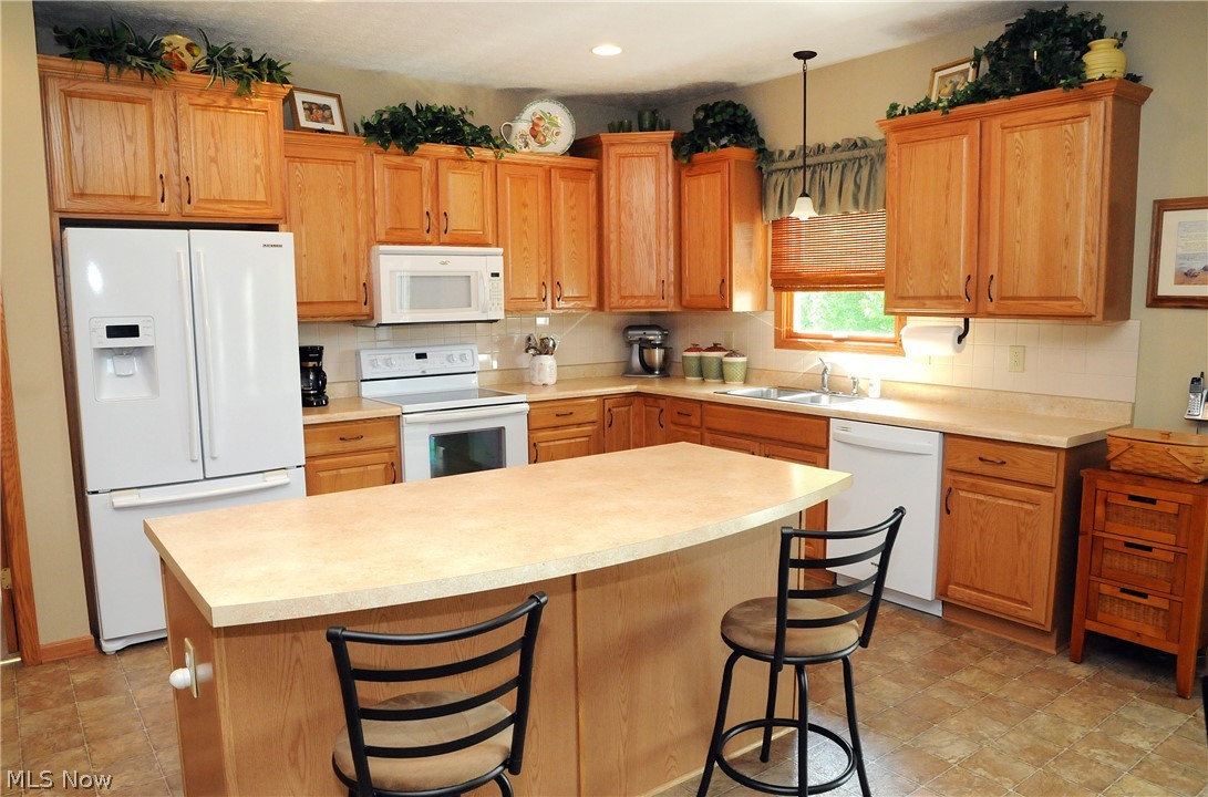 68397 Wintergreen Road Lore City, OH 43755 - Photo 10 of 35 Kitchen with island breakfast bar