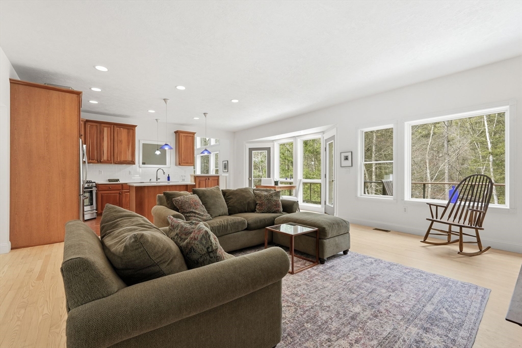 16 North Valley Road Pelham, MA 01002 - Photo 11 of 41 a living room with furniture and a floor to ceiling window