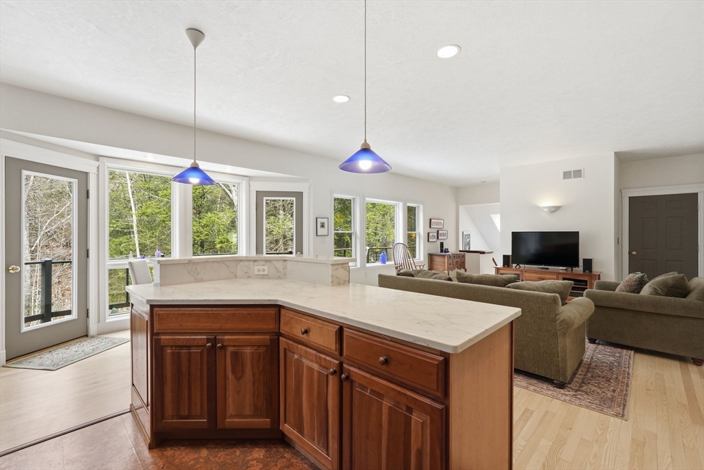 16 North Valley Road Pelham, MA 01002 - Photo 14 of 41 a kitchen with kitchen island granite countertop a stove and a sink with cabinets