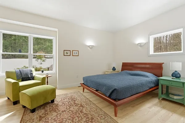 a bed room with a bed and a couch