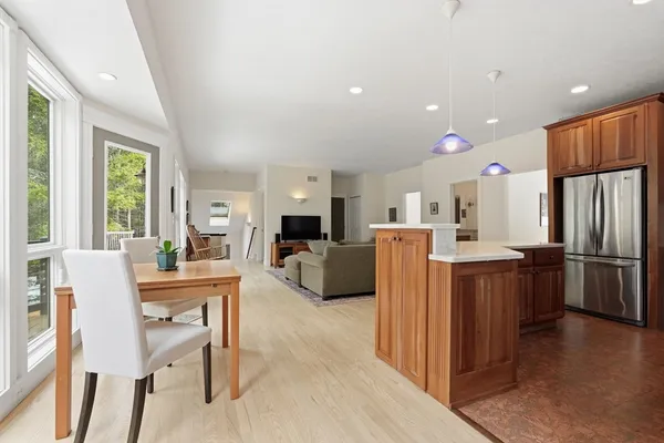 a living room with kitchen island furniture and a kitchen view