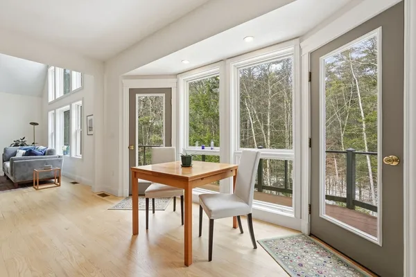 a view of a dining room with furniture window and outside view