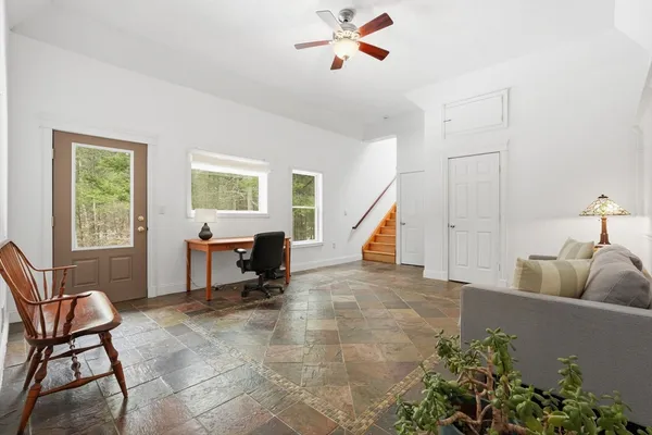 a living room with furniture and a window