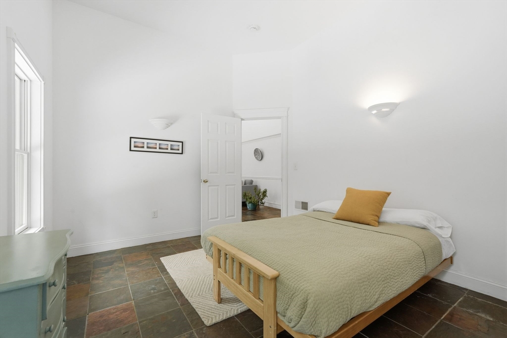 16 North Valley Road Pelham, MA 01002 - Photo 30 of 41 a bedroom with a bed and a table