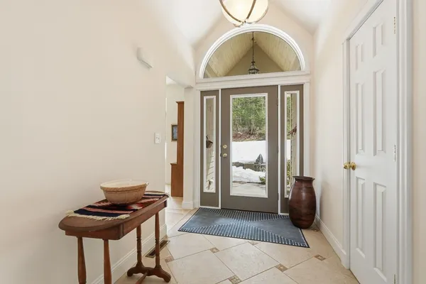 a view of a livingroom with furniture and front door