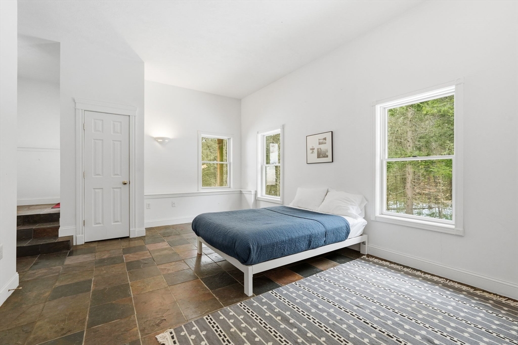 16 North Valley Road Pelham, MA 01002 - Photo 31 of 41 a bedroom with a bed and a window