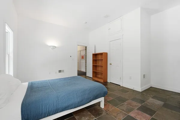 a view of a bedroom with closet
