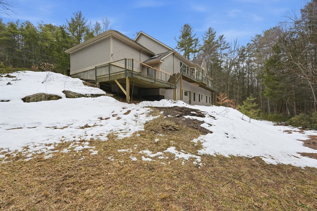 16 North Valley Road Pelham, MA 01002 - Photo 36 of 41 a view of a house with a snow on the road