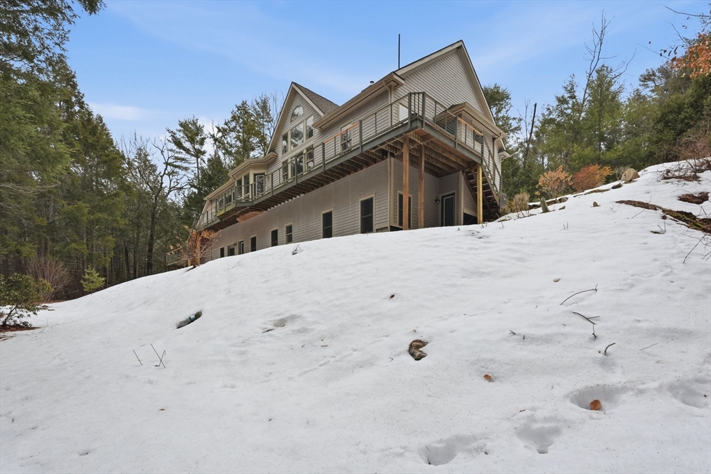 16 North Valley Road Pelham, MA 01002 - Photo 38 of 41 a view of a white house with a snow on the road