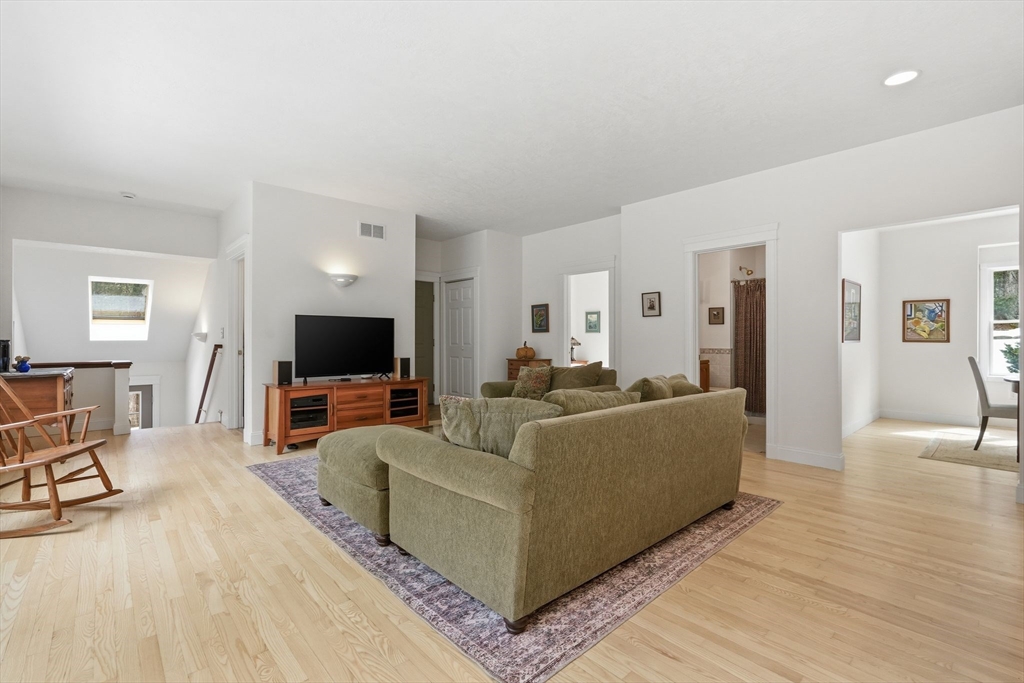 16 North Valley Road Pelham, MA 01002 - Photo 9 of 41 a living room with furniture and a flat screen tv
