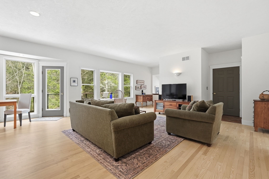 16 North Valley Road Pelham, MA 01002 - Photo 10 of 41 a living room with furniture and a flat screen tv