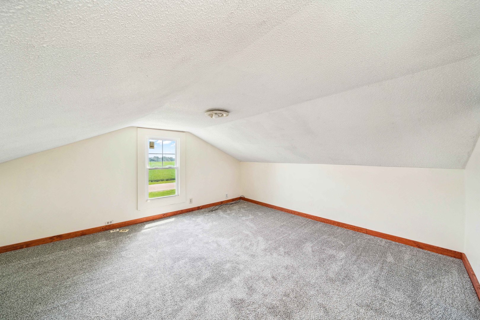 15589 Chicago Road Sandwich, IL 60548 - Photo 12 of 30 an empty room with a window