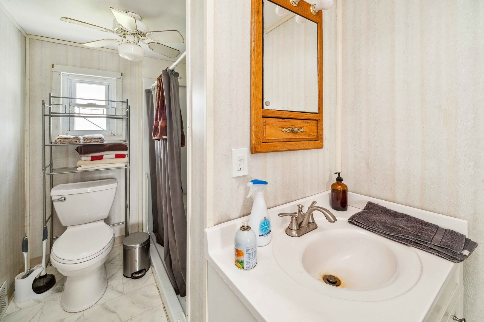 15589 Chicago Road Sandwich, IL 60548 - Photo 14 of 30 a bathroom with a sink a toilet and shower