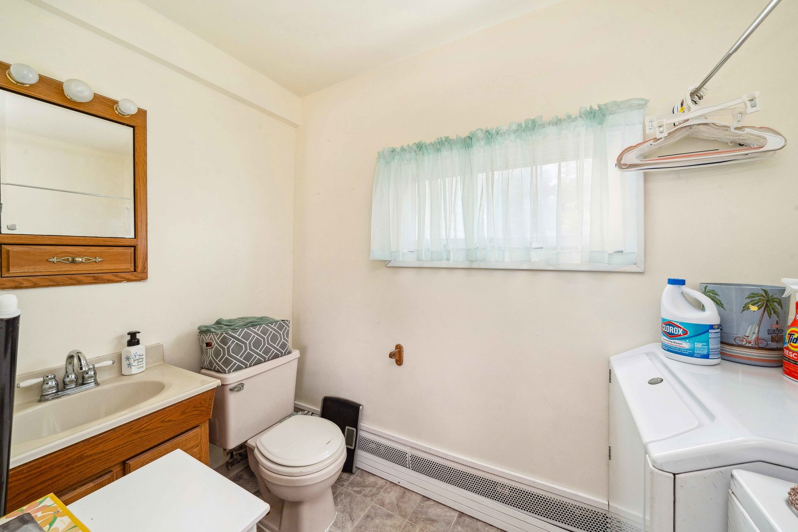15589 Chicago Road Sandwich, IL 60548 - Photo 15 of 30 a bathroom with a sink a toilet and a mirror