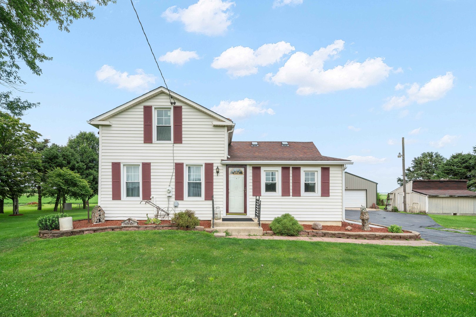 15589 Chicago Road Sandwich, IL 60548 - Photo 18 of 30 a front view of a house with a yard