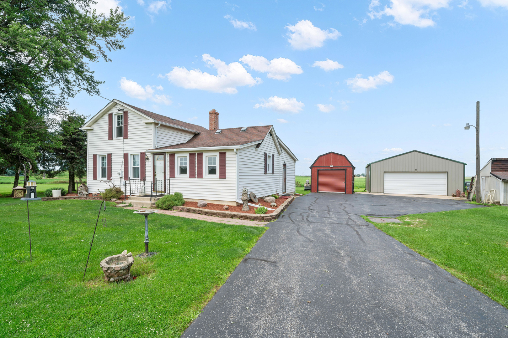 15589 Chicago Road Sandwich, IL 60548 - Photo 20 of 30 a front view of a house with a yard