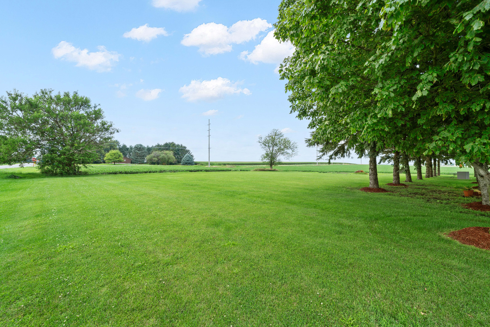 15589 Chicago Road Sandwich, IL 60548 - Photo 29 of 30 a view of grassy field with benches
