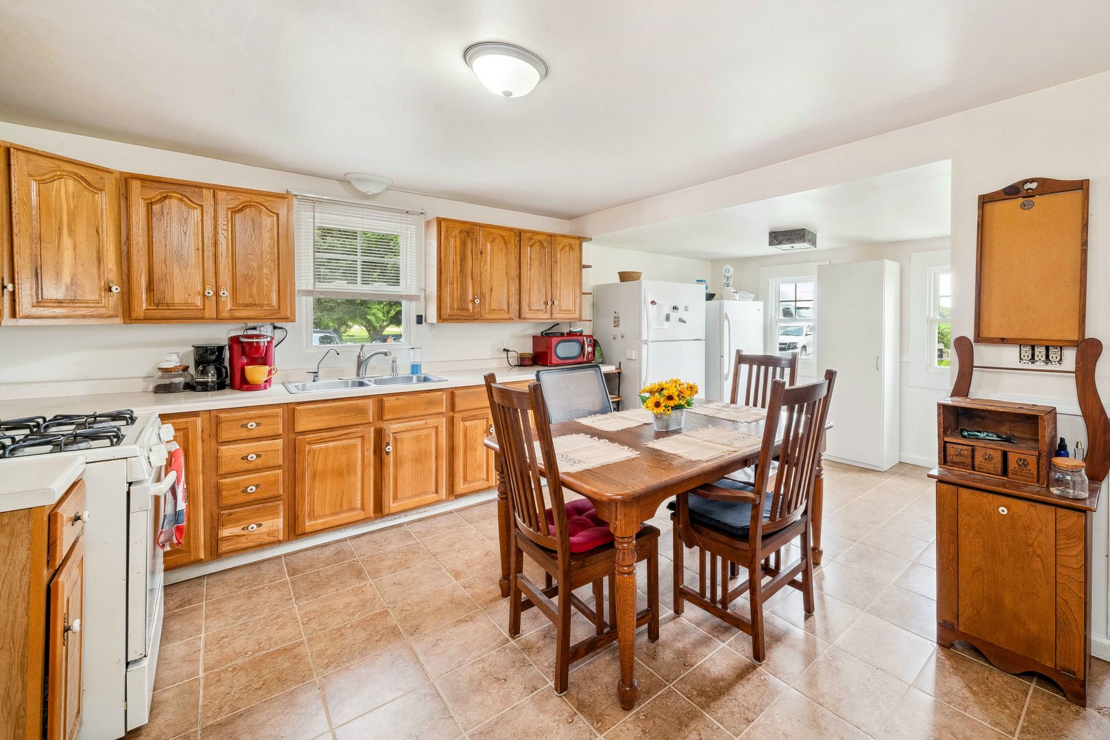 15589 Chicago Road Sandwich, IL 60548 - Photo 4 of 30 a view of a dining room with furniture and a kitchen