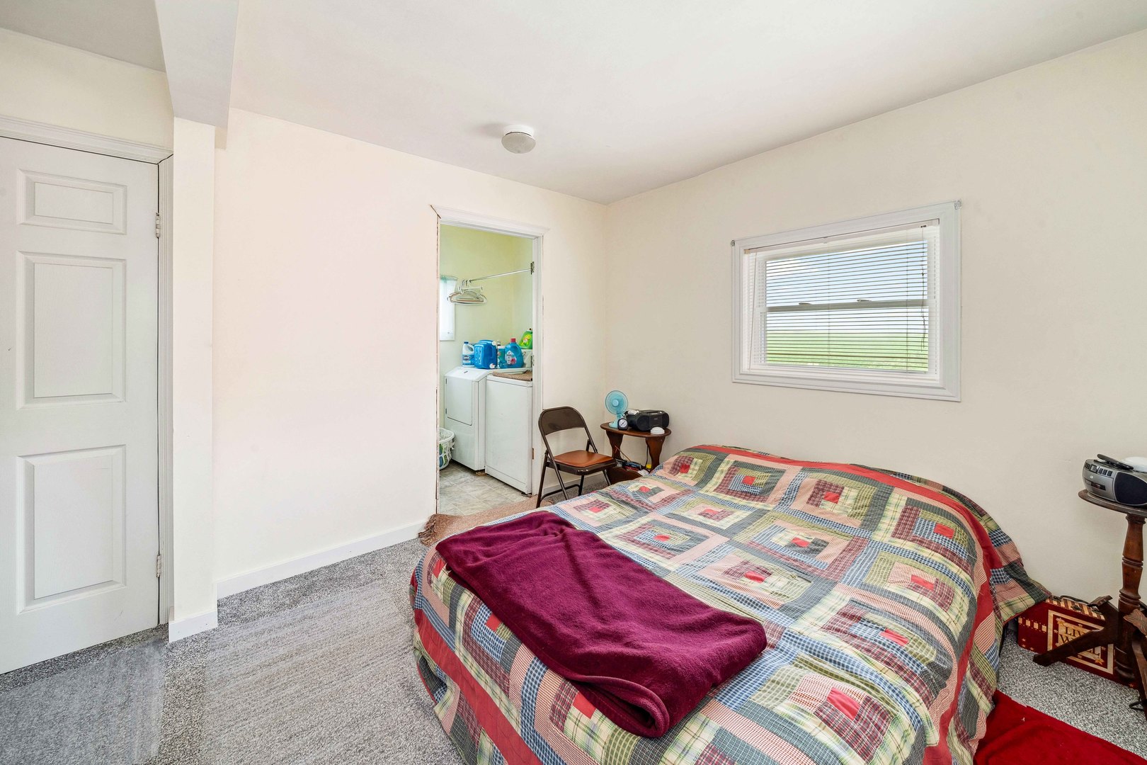 15589 Chicago Road Sandwich, IL 60548 - Photo 9 of 30 a bedroom with a bed and a table in it