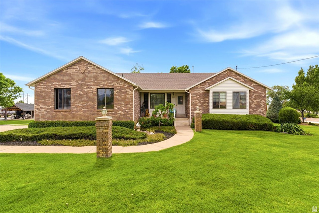5321 South 3100th Street West Roy, UT 84067 - Photo 1 of 64 Brick facade residence with a gabled roofline