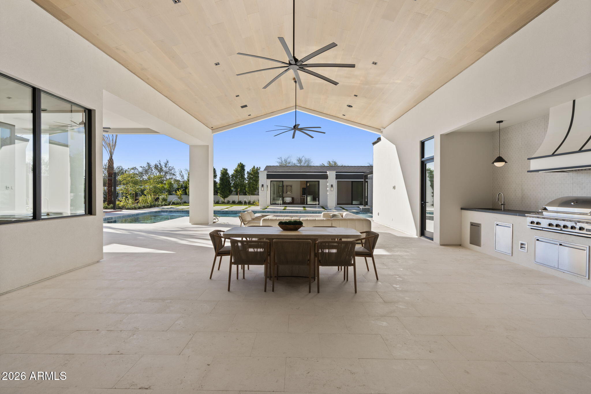 4534 East Pebble Ridge Road Paradise Valley, AZ 85253 - Photo 8 of 12 a dining room with furniture and a large window