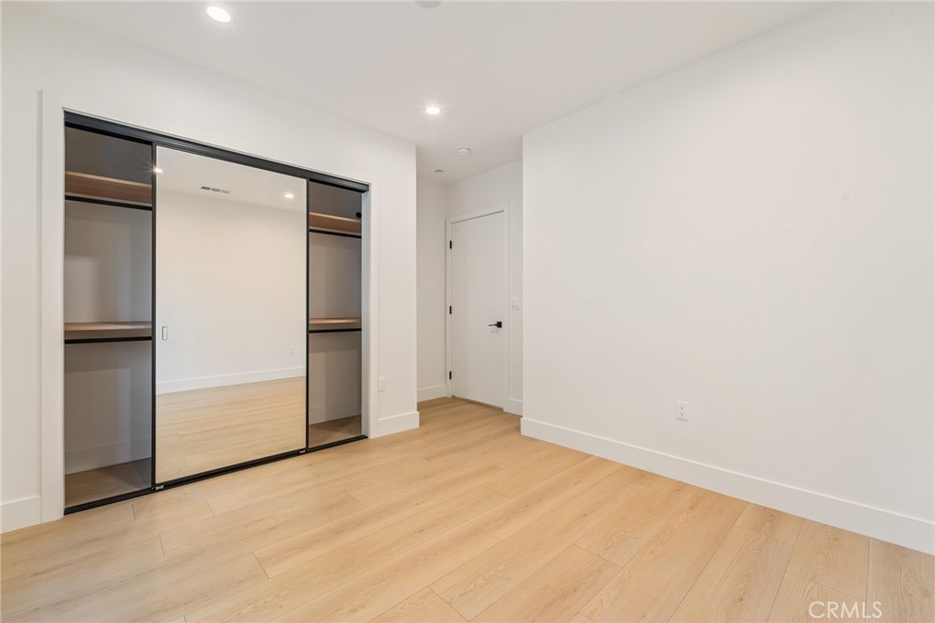7510 Sepulveda Boulevard, Unit 204 Van Nuys, CA 91405 - Photo 14 of 24 an empty room with closet area