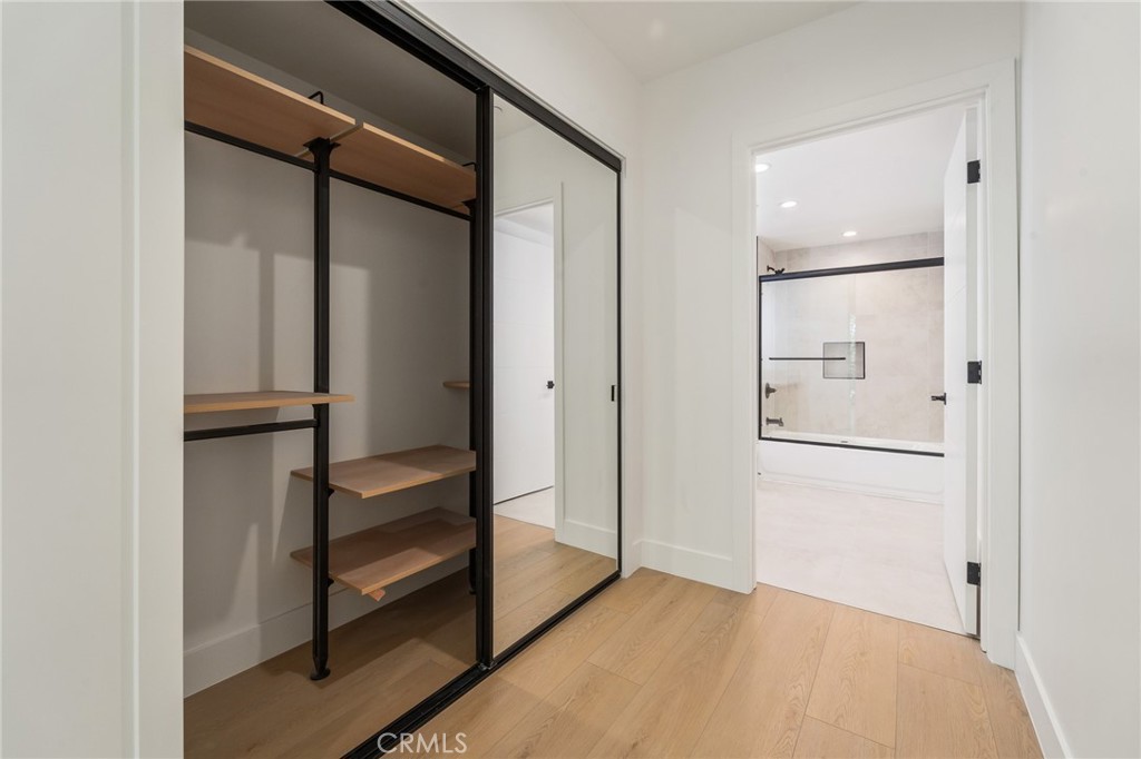 7510 Sepulveda Boulevard, Unit 204 Van Nuys, CA 91405 - Photo 15 of 24 a view of walk in closet with empty racks