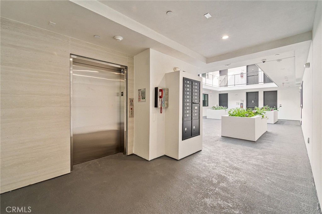 7510 Sepulveda Boulevard, Unit 204 Van Nuys, CA 91405 - Photo 23 of 24 a view of a big room with closet and windows
