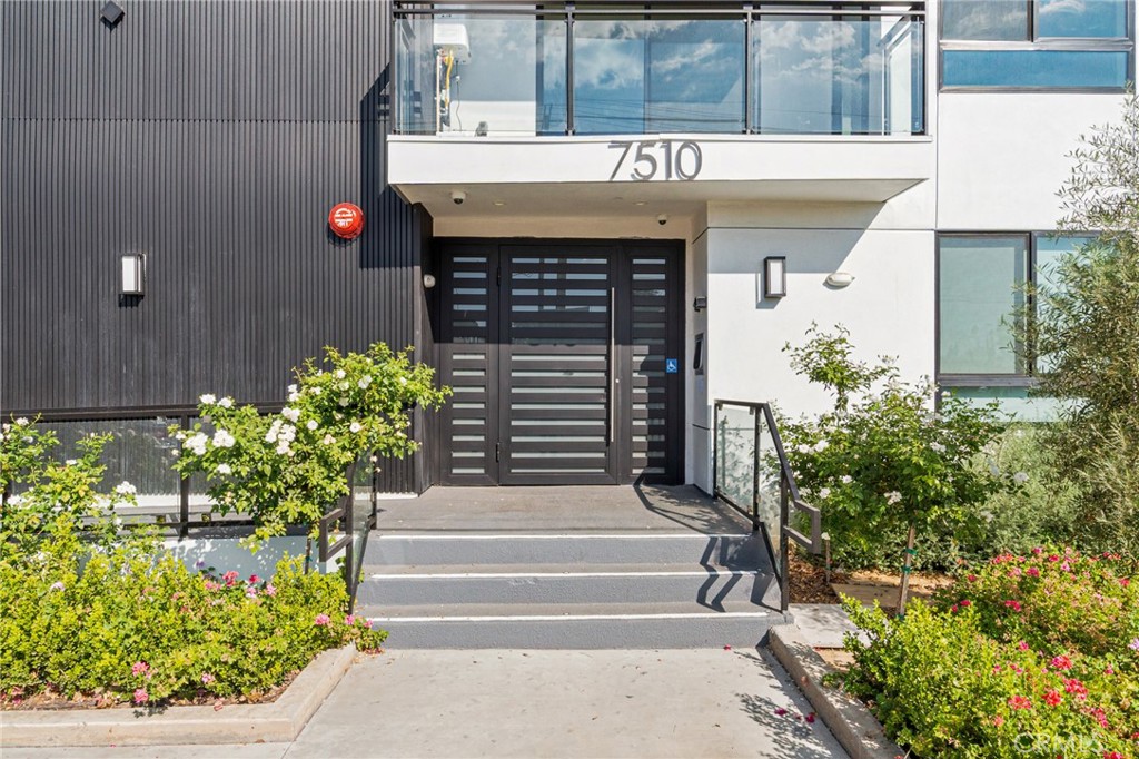 7510 Sepulveda Boulevard, Unit 204 Van Nuys, CA 91405 - Photo 4 of 24 a front view of a house with plants