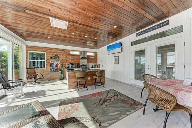 a kitchen with stainless steel appliances granite countertop a sink a stove and cabinets