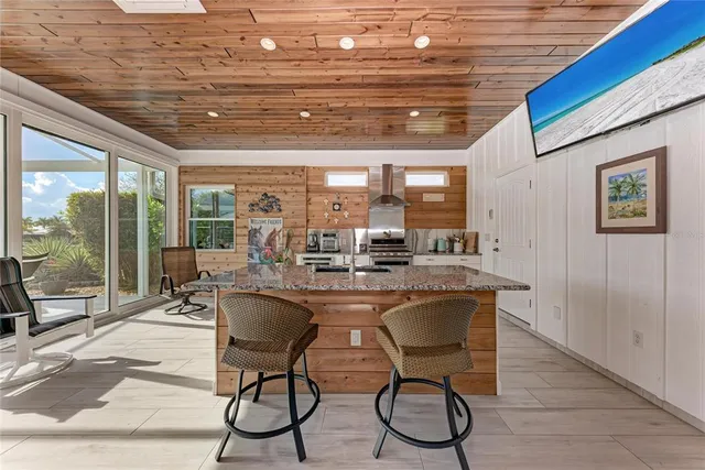 a kitchen with stainless steel appliances granite countertop a stove and a sink