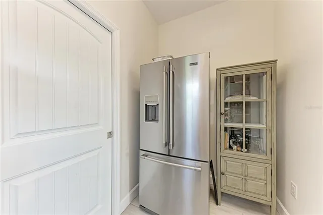 a view of a storage and utility room with washer and dryer