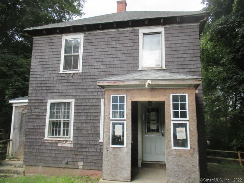 513 Main Street Killingly, CT 06239 - Photo 1 of 1 a front view of a house with garage