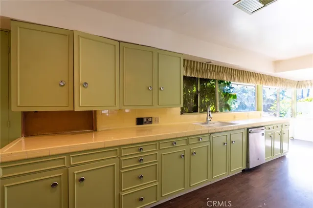 a kitchen with a sink and cabinets