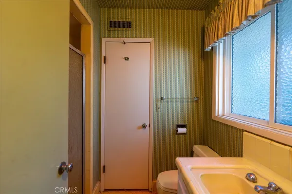 a bathroom with a tub and sink