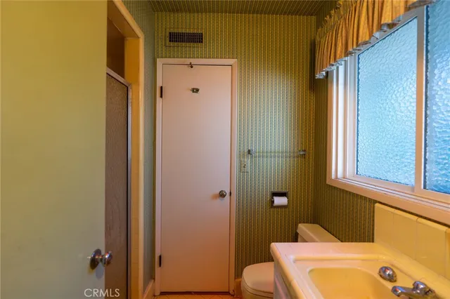 a bathroom with a tub and sink