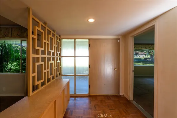 a view of entryway with wooden floor