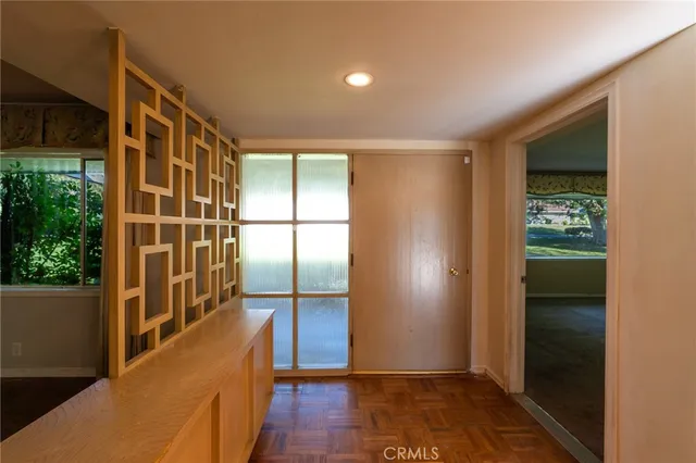 a view of entryway with wooden floor