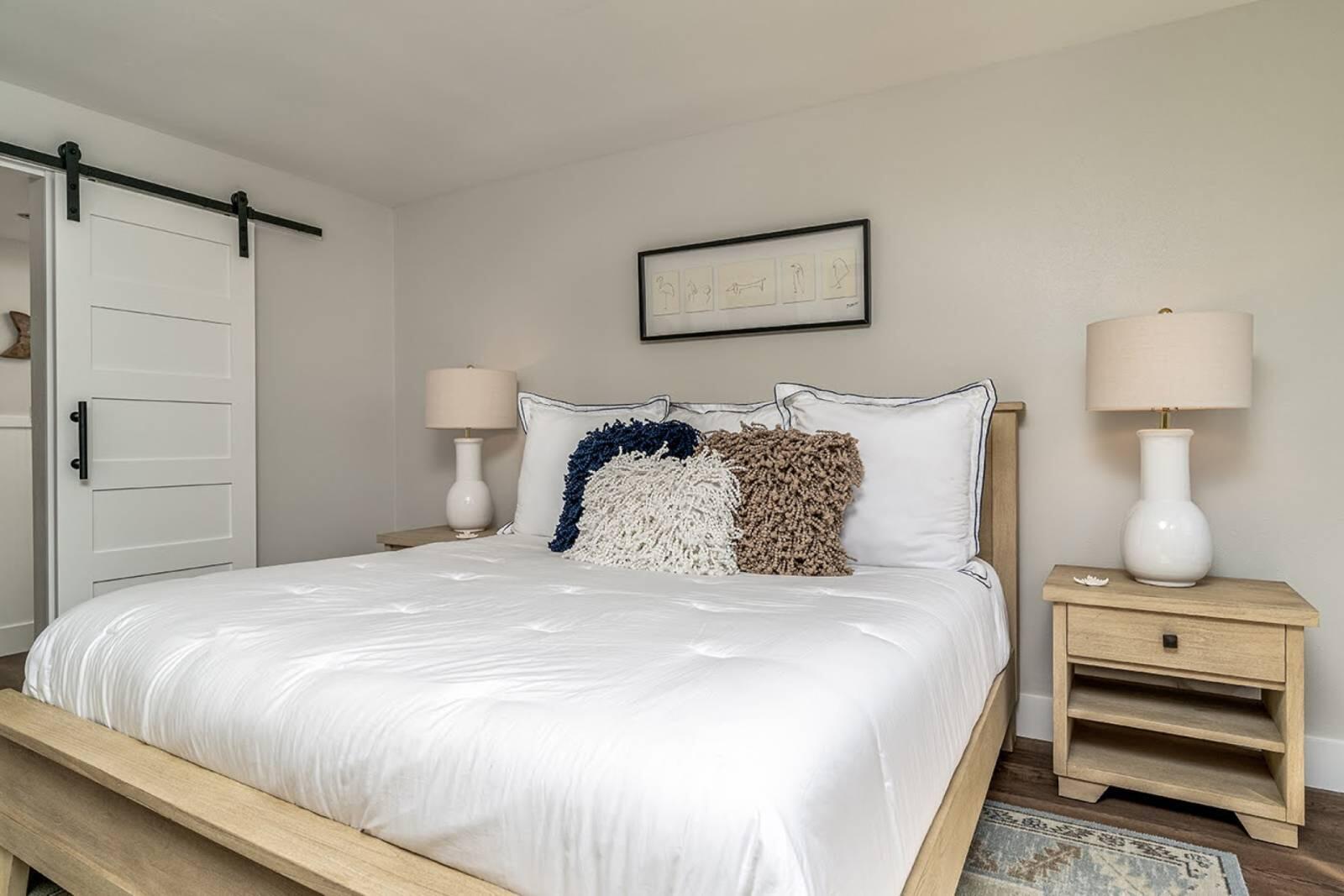 4017 Beachside 1, Unit 4017 Miramar Beach, FL 32550 - Photo 12 of 26 a bedroom with a bed and a night stand