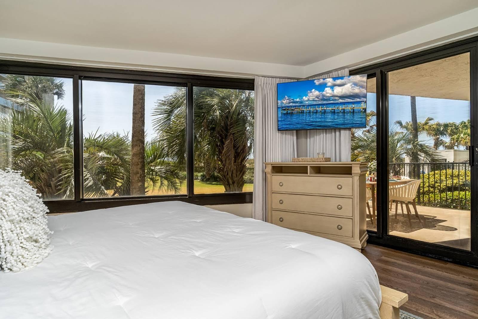 4017 Beachside 1, Unit 4017 Miramar Beach, FL 32550 - Photo 13 of 26 a bedroom with a bed and large window