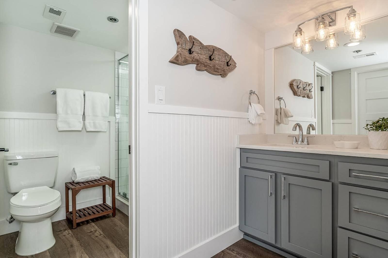4017 Beachside 1, Unit 4017 Miramar Beach, FL 32550 - Photo 14 of 26 a bathroom with a toilet sink and mirror