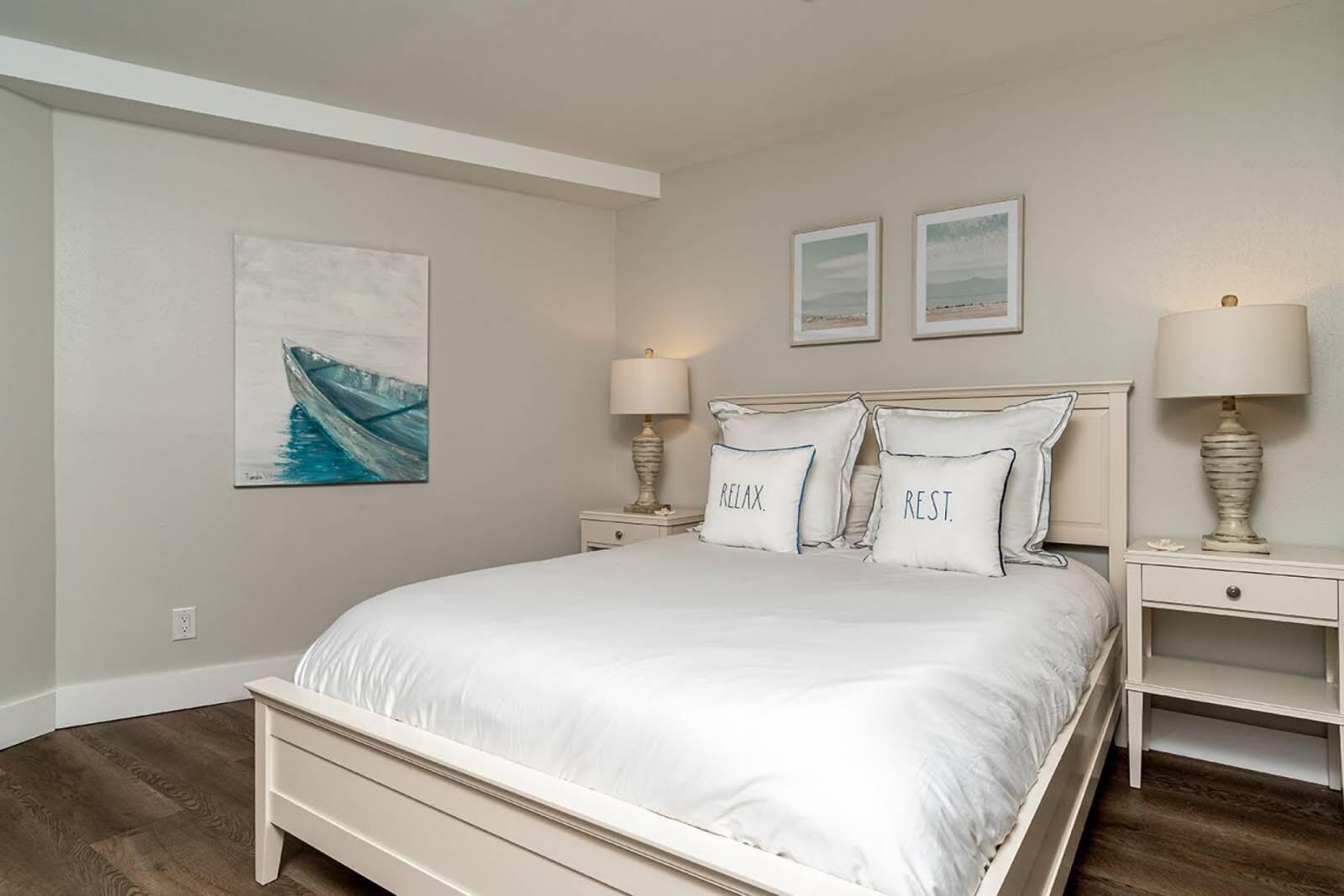 4017 Beachside 1, Unit 4017 Miramar Beach, FL 32550 - Photo 17 of 26 a bedroom with a bed and a lamp on dresser