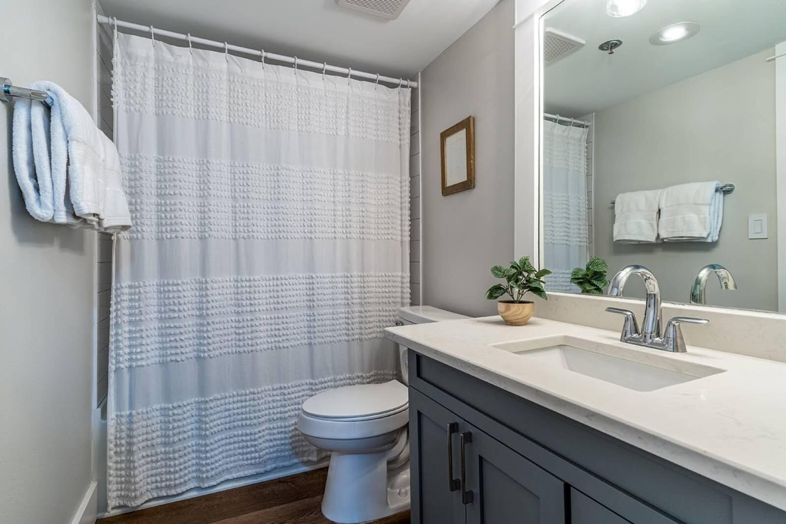 4017 Beachside 1, Unit 4017 Miramar Beach, FL 32550 - Photo 18 of 26 a bathroom with a sink a toilet and shower