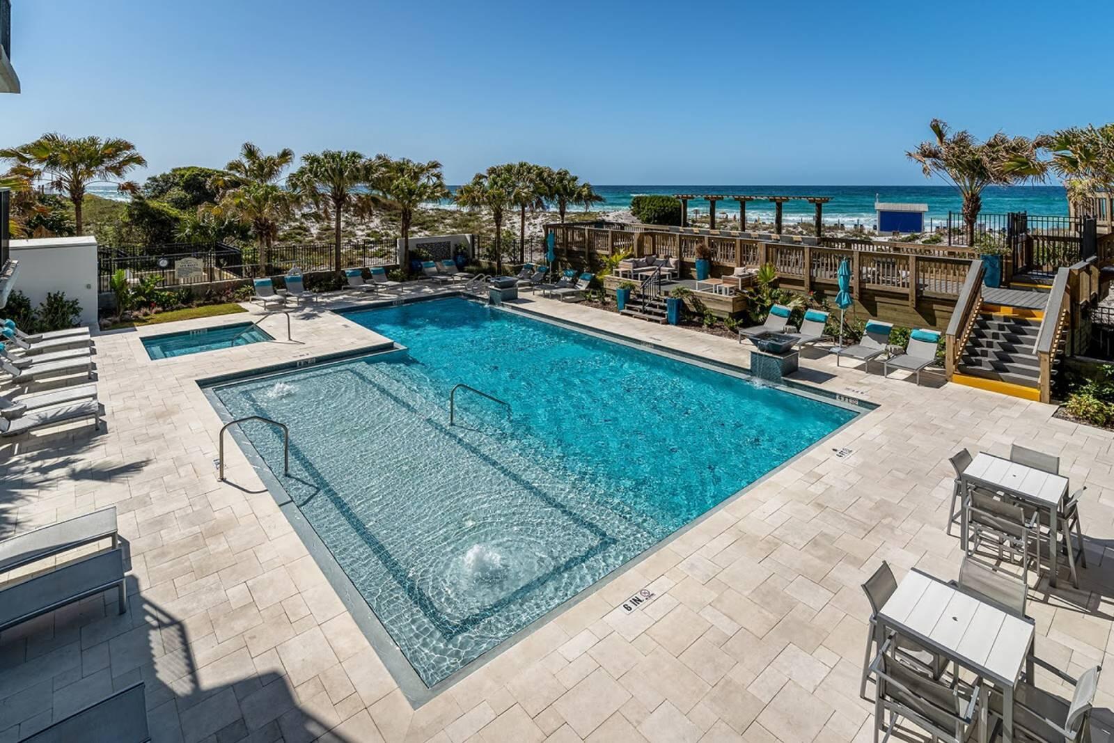 4017 Beachside 1, Unit 4017 Miramar Beach, FL 32550 - Photo 19 of 26 a view of a chairs and table in patio