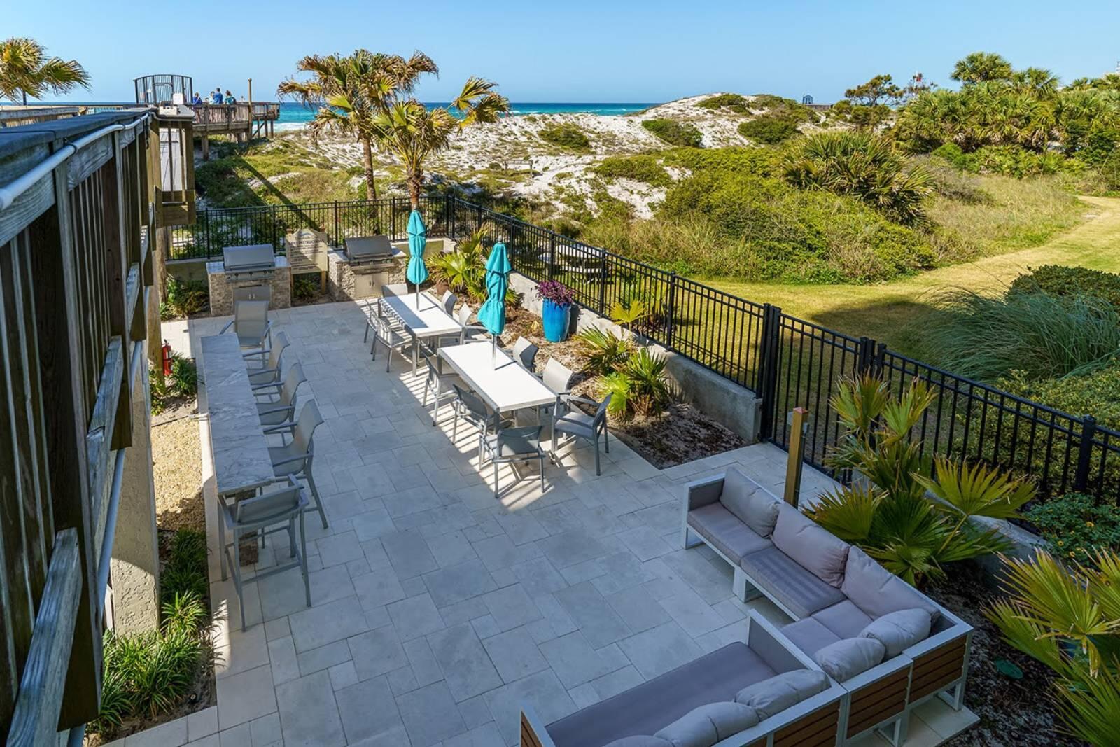 4017 Beachside 1, Unit 4017 Miramar Beach, FL 32550 - Photo 22 of 26 a view of a chairs and table in patio