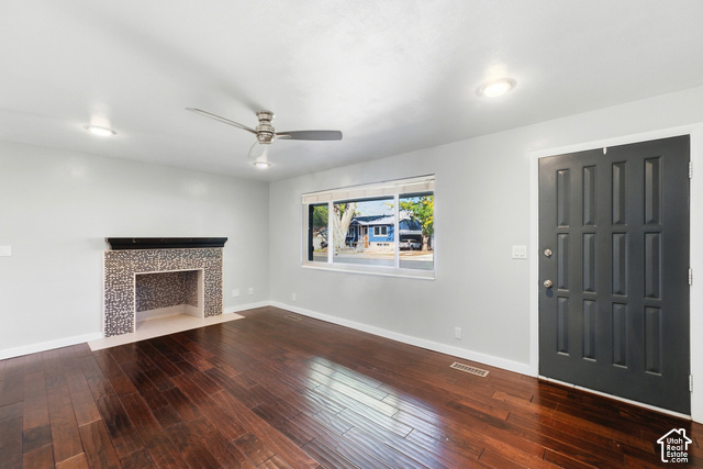 8746 Gladiator Way Sandy, UT 84094 - Photo 8 of 36 Dark wood-finish flooring, recessed lighting, and a modern ceiling fan