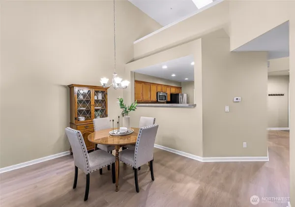a view of a dining room with furniture and wooden floor